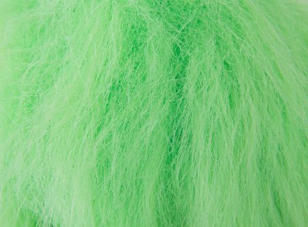 Closeup picture of green fake hair on a dollの写真素材