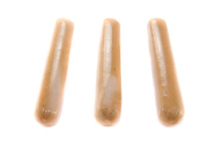 A picture of three single sausages with nothing onの写真素材