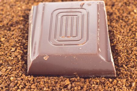 Picture of a chocolate piece on cofee powderの写真素材
