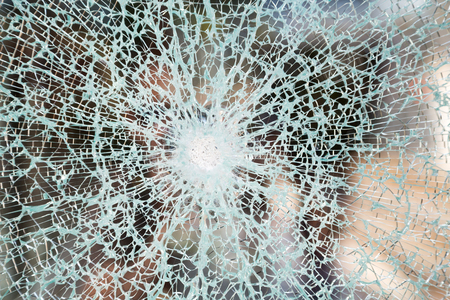 Picture of a window that has been vandalisedの写真素材