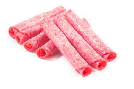 Picture of several salami slices formed as rollsの写真素材