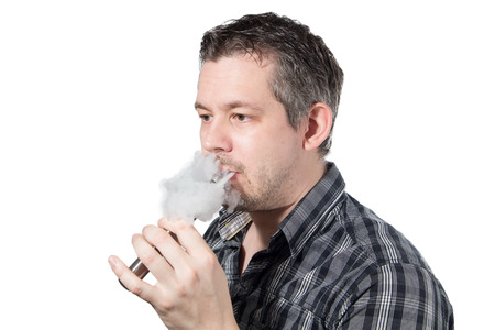 Picture of a man smoking on a e cigarette with smoke beeing exhaled