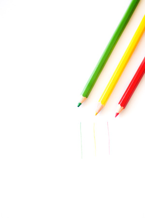 Colored pencils on a white sheet of paperの写真素材