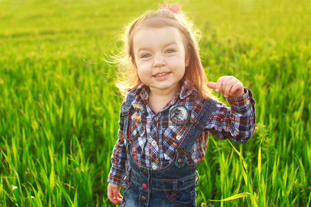 little girl s in the field. portraitの写真素材