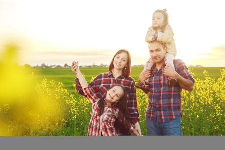 family in the field.の写真素材