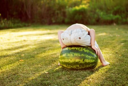 child with a watermelonの写真素材