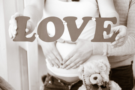 Pregnant woman with her husband happyの写真素材