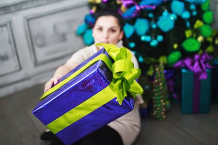 girl holds a gift in their handsの写真素材
