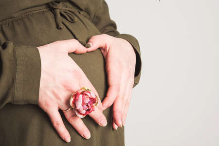 pregnant woman with a heart at the stomachの写真素材