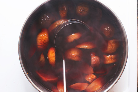 stewed fruit is cooked on the stoveの写真素材