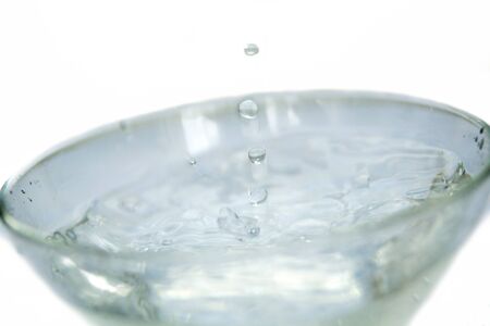 Water drips into the bowl with splashes