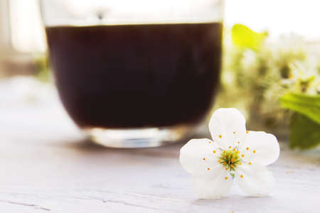 cup of coffee with spring flowersの写真素材