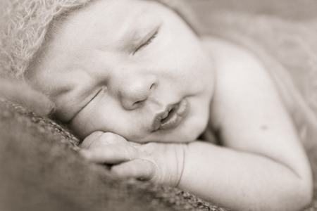 newborn baby sleeping sweetly. Black and white.の写真素材