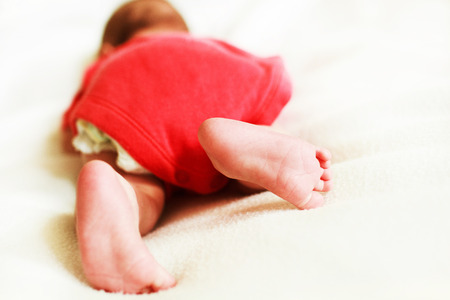 feet newborn baby on a white blanket.の写真素材