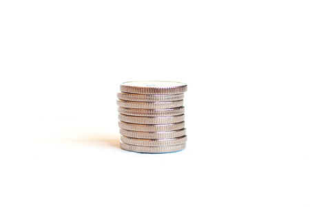A stack of coins on an isolated white backgroundの写真素材