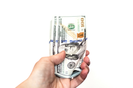 Hand with dollar bills on a white background
