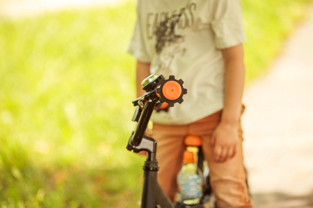 Boy with a bicycle on the streetの写真素材