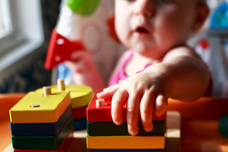 the child plays with an educational toyの写真素材