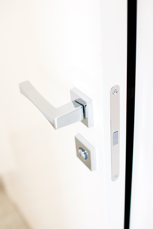 door handle on white doorの写真素材