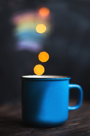 a cup  on the wooden background . Christmas bokehの写真素材