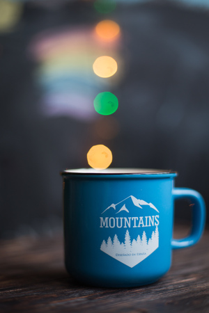 a cup  on the wooden background . Christmas bokehの写真素材