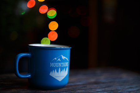 a cup  on the wooden background . Christmas bokehの写真素材