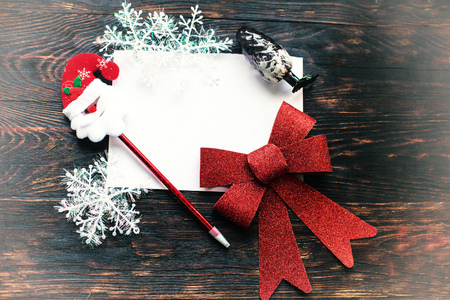 christmas card on a wooden backgroundの写真素材