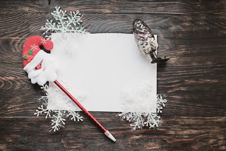 christmas card on a wooden backgroundの写真素材