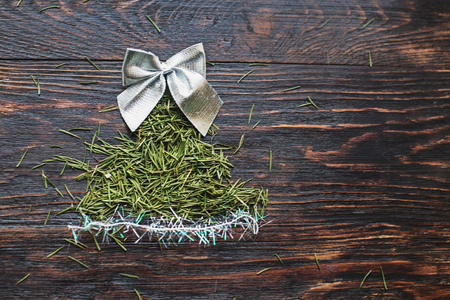 christmas card.  fir tree of needles on wooden backgroundの写真素材