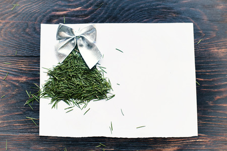 christmas card.  fir tree of needles on wooden backgroundの写真素材