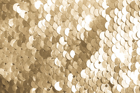 background of gold sequins. shiny sparkling backgroundの写真素材