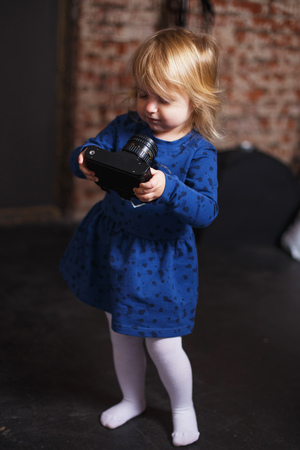 girl  with a camera. Little girl takes picturesの写真素材