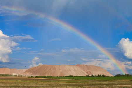 Soligorsk mountains. potash plant. Potash mountains near Soligorsk City. rainbow in the skyの写真素材