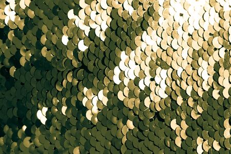 background of gold sequins. shiny sparkling backgroundの写真素材