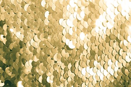 background of gold sequins. shiny sparkling backgroundの写真素材