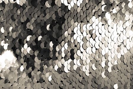 background of silver sequins. shiny sparkling backgroundの写真素材