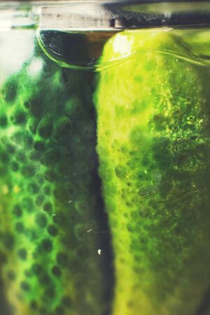pickled cucumbers in a glass jar close. gherkins cucumbers  backgroundの写真素材