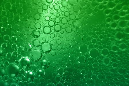 abstract green background with oil circles .  bubbles of water close up . oil bubbles in the water macro.  circle bubbles  backgroundの写真素材