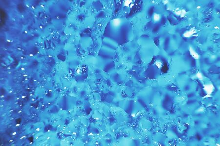 water drops on a blue background. Abstract blue background. Water drops on glass. Natural background...