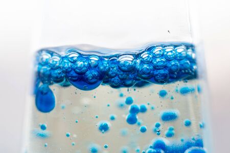 blue bubbles in a glass of water.Blue tone,Abstract Backgroundsの写真素材