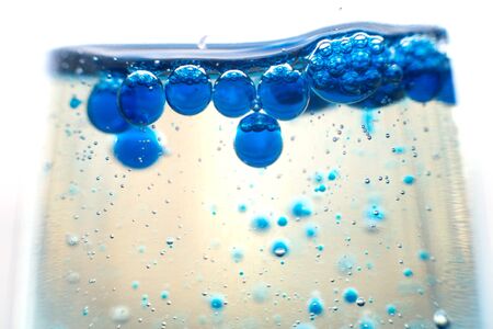 blue bubbles in a glass of water.Blue tone,Abstract Backgroundsの写真素材