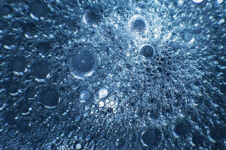 abstract light blue background with oil circles . bubbles of water close up . oil bubbles in the water macro. circle bubbles backgroundの写真素材