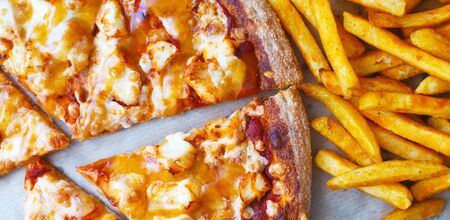 Unhealthy concept. Fast Food - Pizza, Fried Potato. Close up.の写真素材