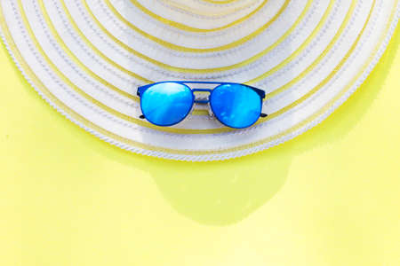 Travel vacation background. Sun glasses yellow background. Concept summer holidays.の写真素材