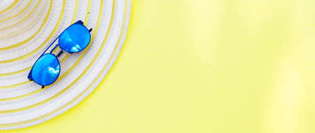 Travel vacation background. Sun glasses yellow background. Concept summer holidays. bannerの写真素材