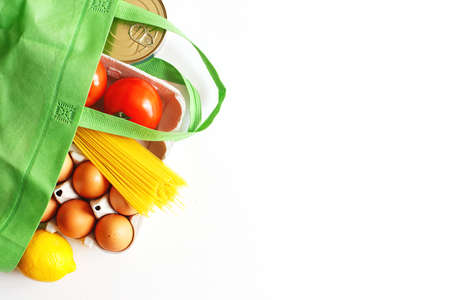 Full green bag of healthy products food on a white background. Top view. online shop. your text. food deliveryの写真素材