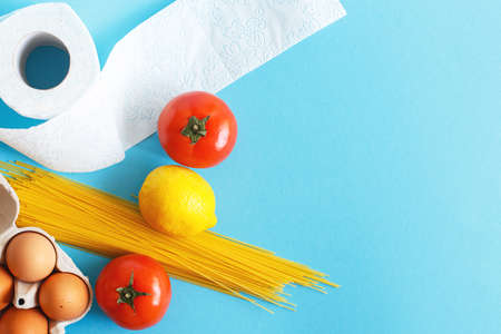 Different healthy food products on a blue background. Top view. Flat lay. Grocery online shop backgroundの写真素材