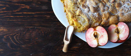 apple pie on the white plate on the on the wooden background. bannerの写真素材