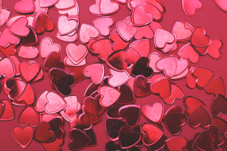 red hearts confetti background. wedding invitation, Valentines background, love, date concept.の写真素材