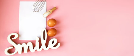 Ingredients for cooking baking - egg, sugar, rolling pin on pink background. Concept of cooking dessert and sweet food. bannerの写真素材